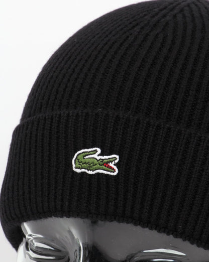 Lacoste – Gerippte Wollmütze mit Umschlag in Schwarz