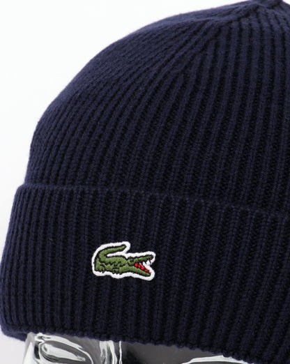 Lacoste – Gerippte Wollmütze mit Umschlag in Marineblau
