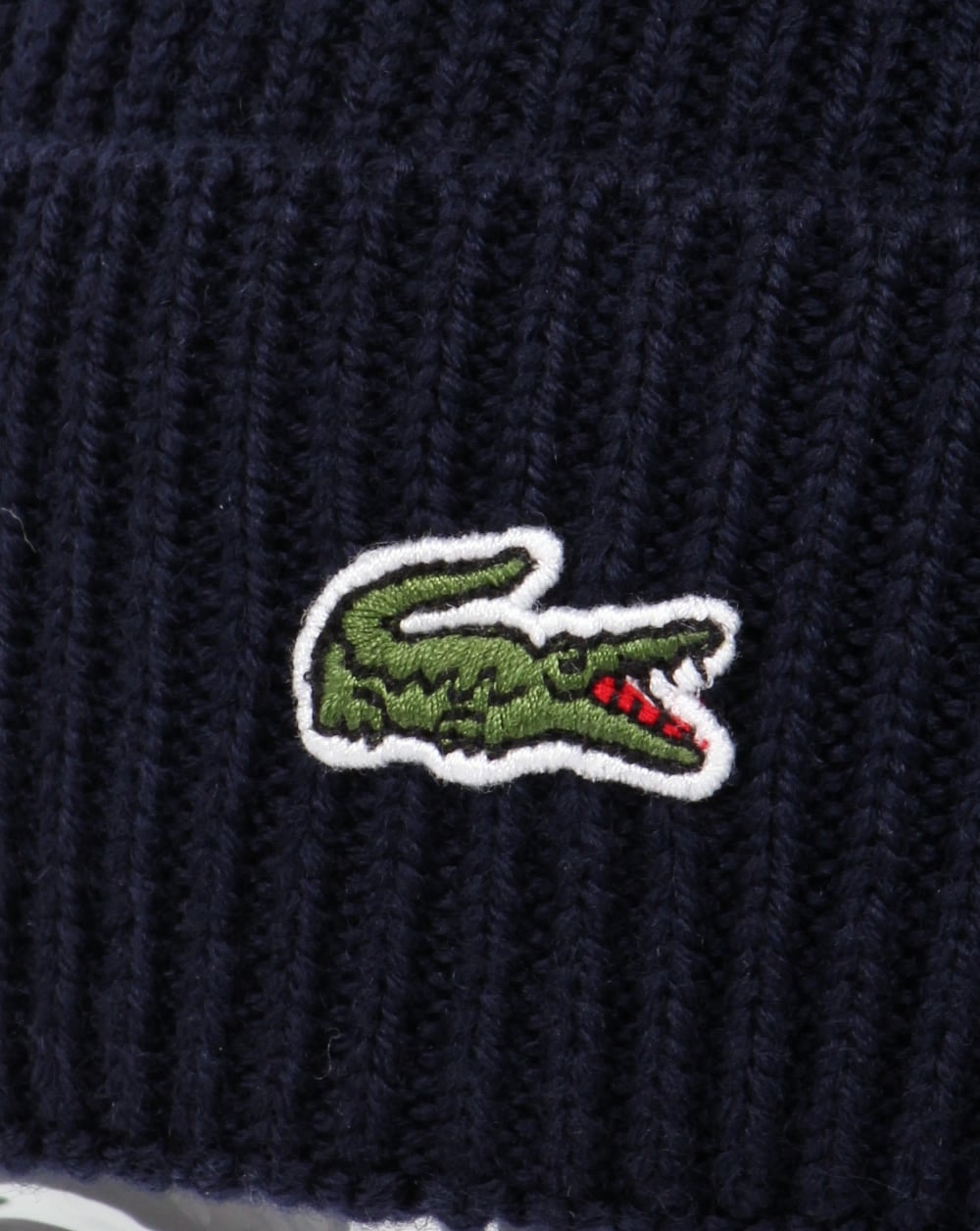Lacoste – Gerippte Wollmütze mit Umschlag in Marineblau