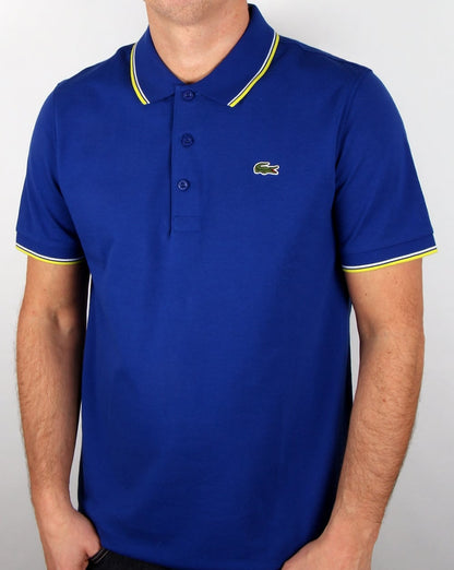 Lacoste – Poloshirt mit Streifen in Französischblau/Zitronengelb