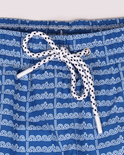 Lacoste – Badeshorts mit linearem Logo, Thermoblau