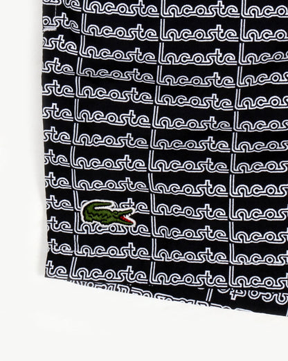 Lacoste – Badeshorts mit linearem Logo in Marineblau