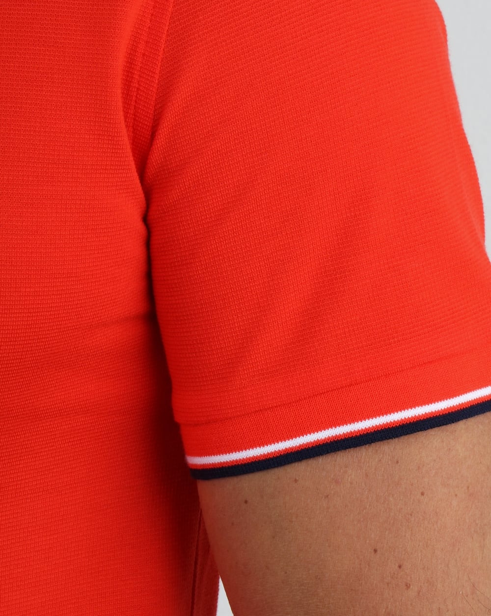 Lacoste Poloshirt mit Streifen Ätnarot/Marineblau