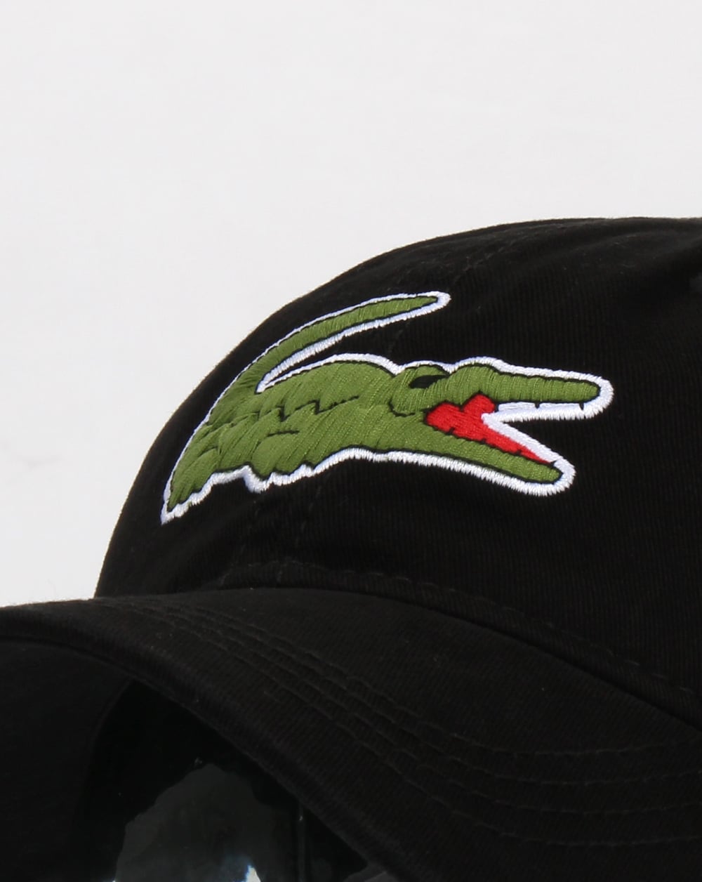Lacoste – Oversize-Kappe in Kroko-Optik in Schwarz