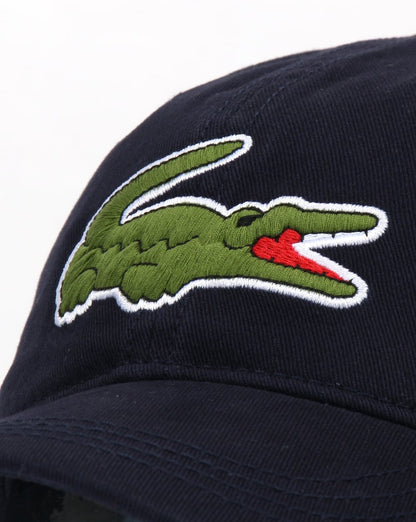 Lacoste – Übergroße Kroko-Kappe in Marineblau