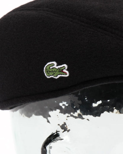 Lacoste Schiebermütze aus Wollstoff in Schwarz