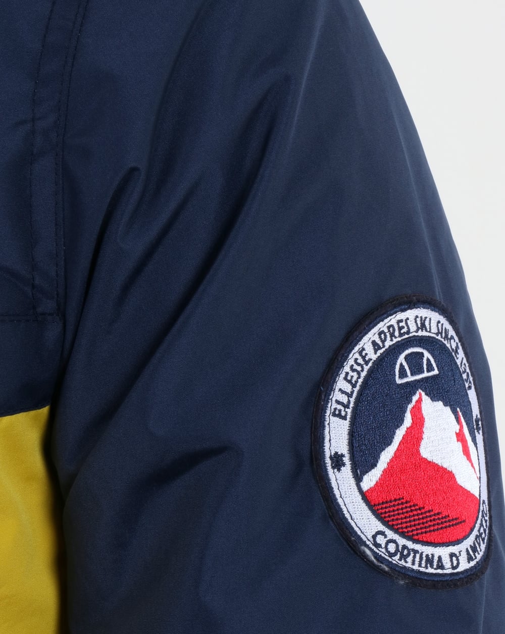 Ellesse – Überziehjacke mit Viertelreißverschluss in Marineblau/Gelb