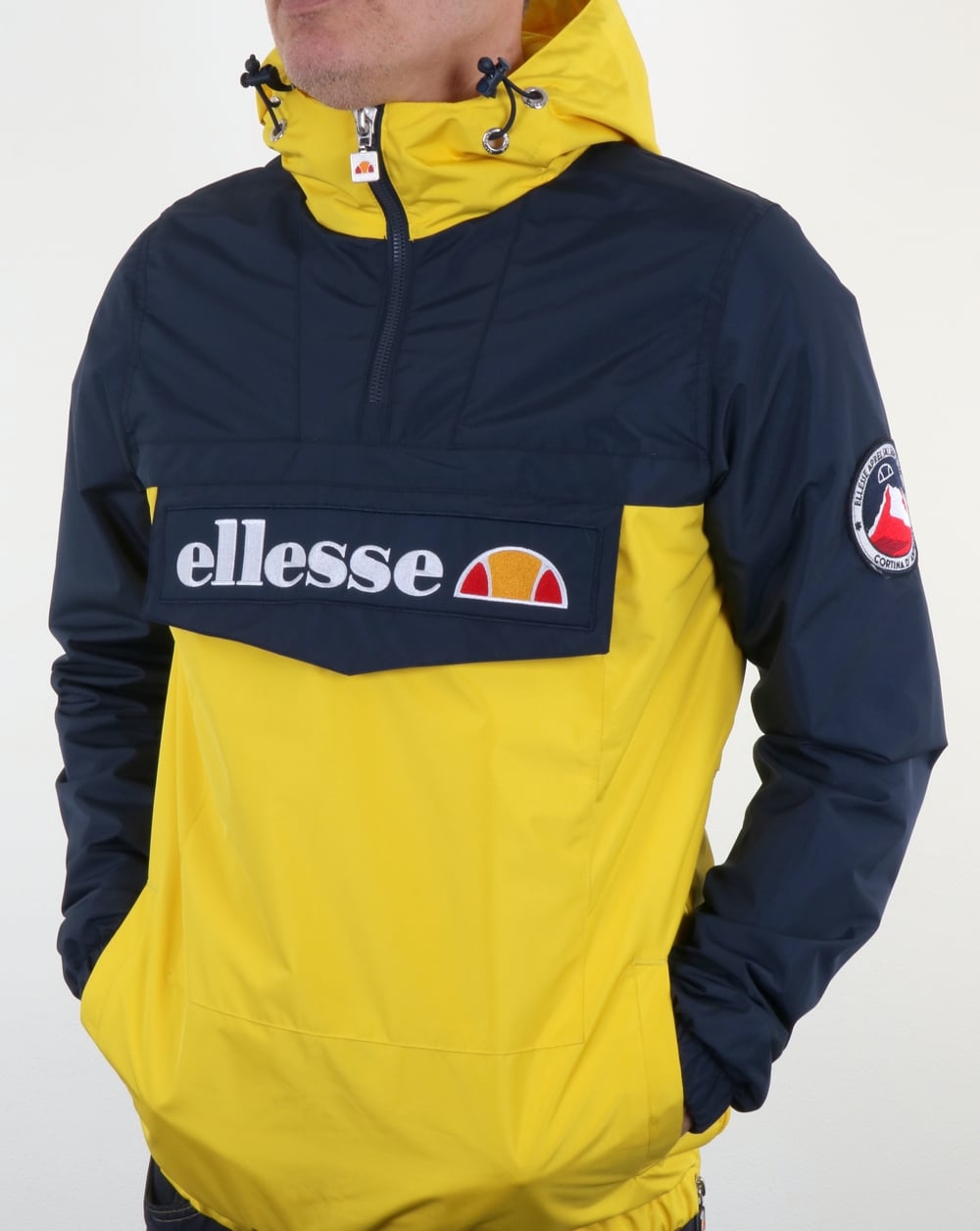 Ellesse – Überziehjacke mit Viertelreißverschluss in Marineblau/Gelb