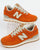 New Balance 574 Trainers Orange/Moonbeam