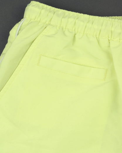 Ellesse – Beach-Badeshorts in Zartgelb