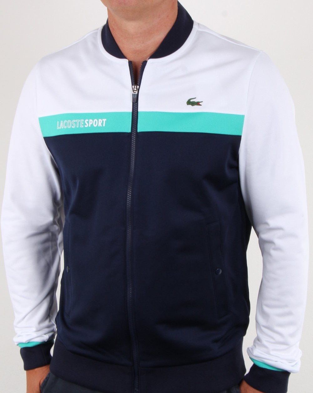 Lacoste – Gestreiftes Trainingsoberteil in Weiß/Marineblau/Aqua