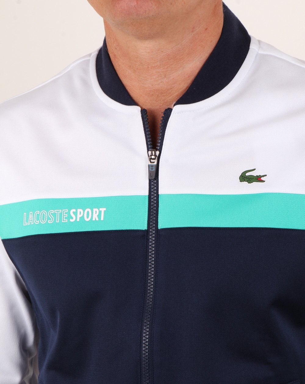 Lacoste – Gestreiftes Trainingsoberteil in Weiß/Marineblau/Aqua