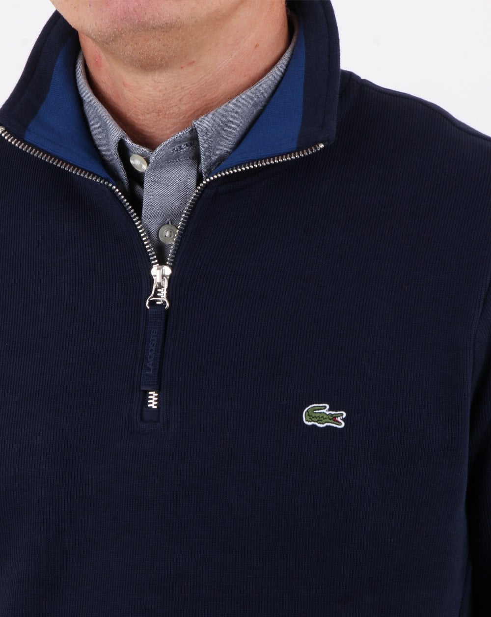 Lacoste – Oberteil mit Viertelreißverschluss in Marineblau