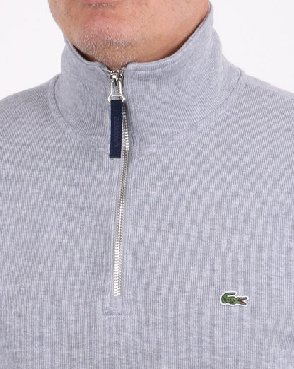 Lacoste – Oberteil mit Viertelreißverschluss in Grau