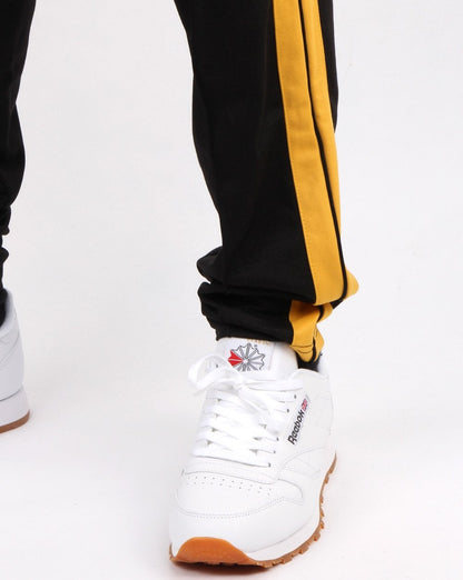 Ellesse Cassed Track Pant Schwarz/Gelb