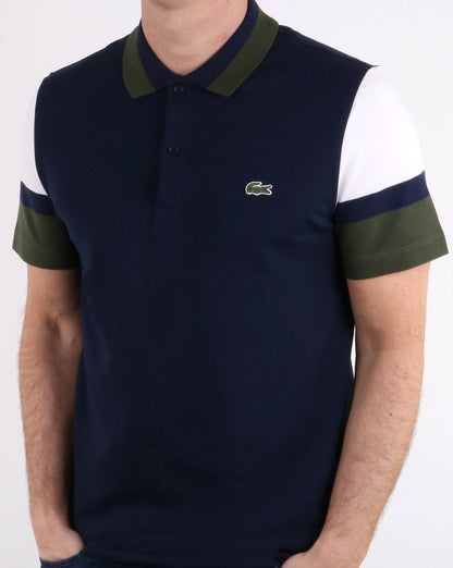 Lacoste Poloshirt mit farbigen Ärmeln in Marineblau, Weiß und Grün