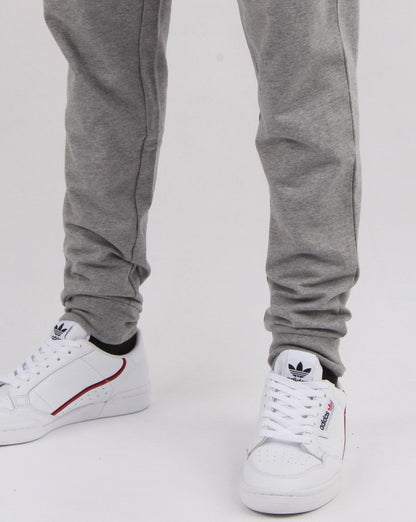 Emporio Armani EA7 – Schmal geschnittene Trainingshose in Grau