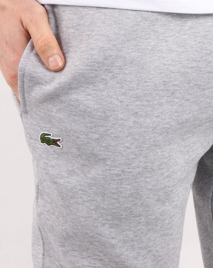 Lacoste – Schmale Trainingshose mit Bündchen in Grau