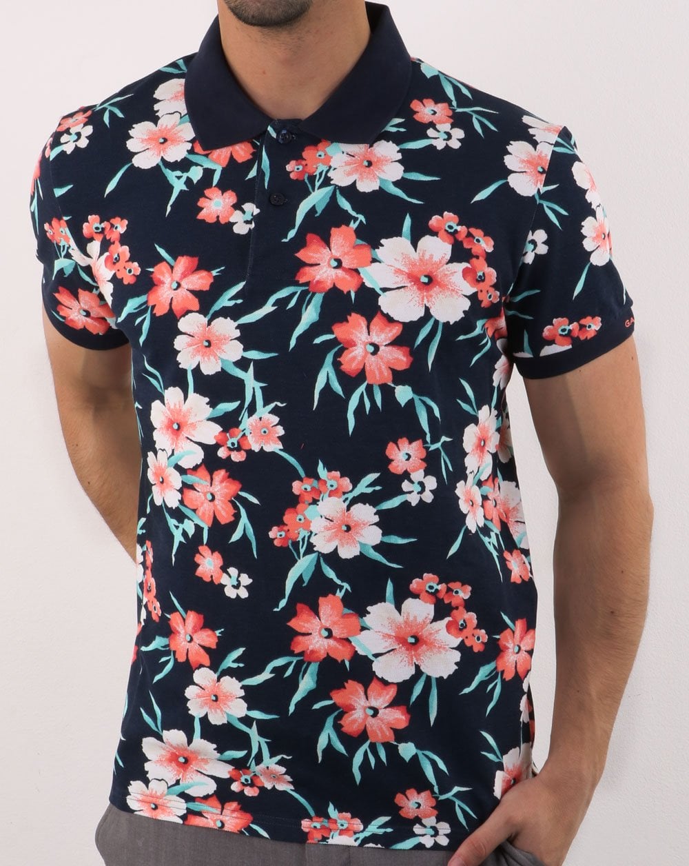 Gant – Piqué-Poloshirt mit durchgehendem Blumenmuster