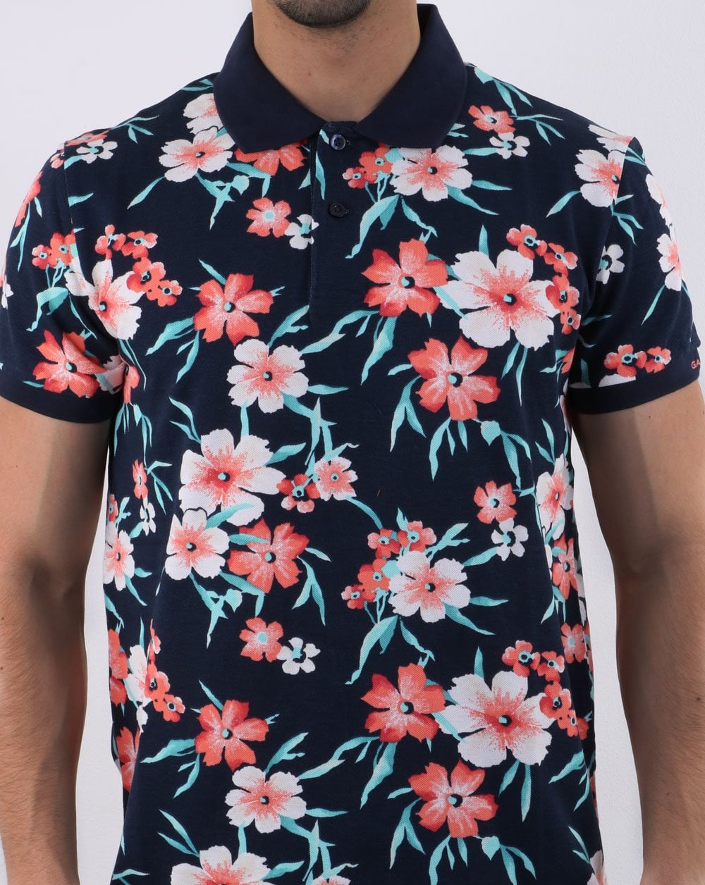 Gant – Piqué-Poloshirt mit durchgehendem Blumenmuster