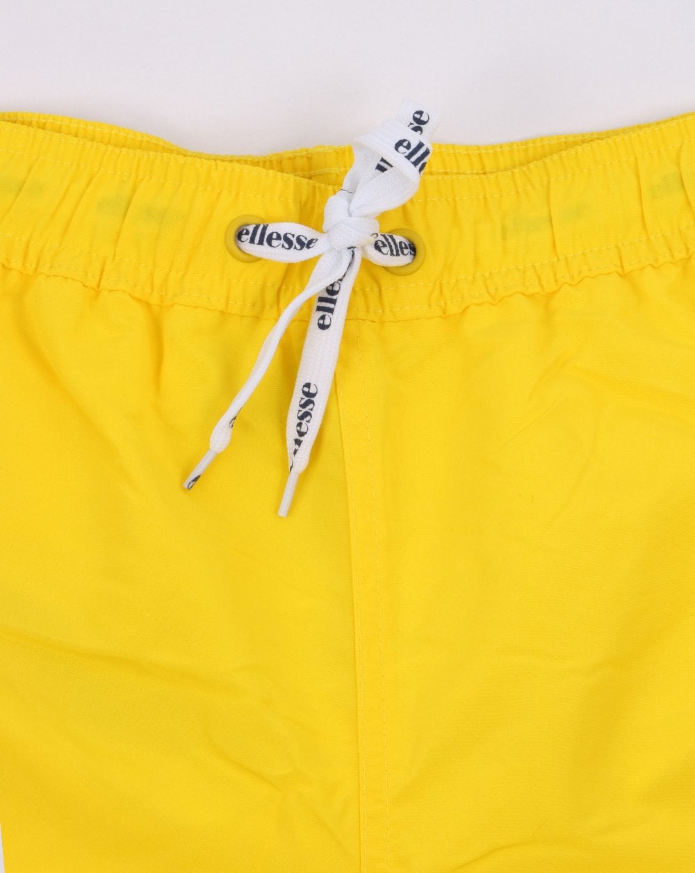 Ellesse – Nono – Badeshorts in Gelb
