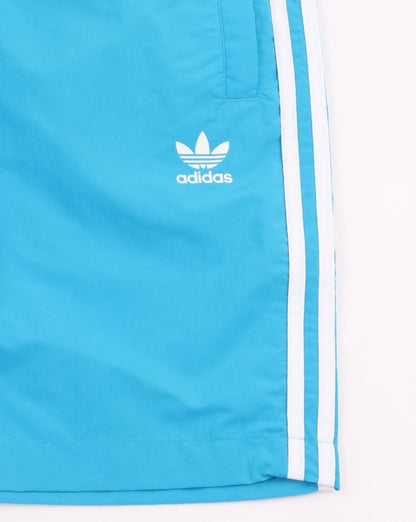 Adidas Originals – Badeshorts mit 3 Streifen in Shock Cyan