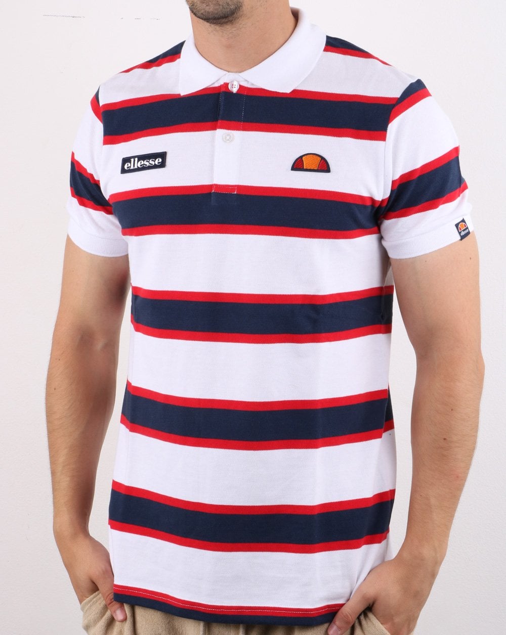 Ellesse – Poloshirt mit kräftigen Streifen, Weiß/Marineblau/Rot