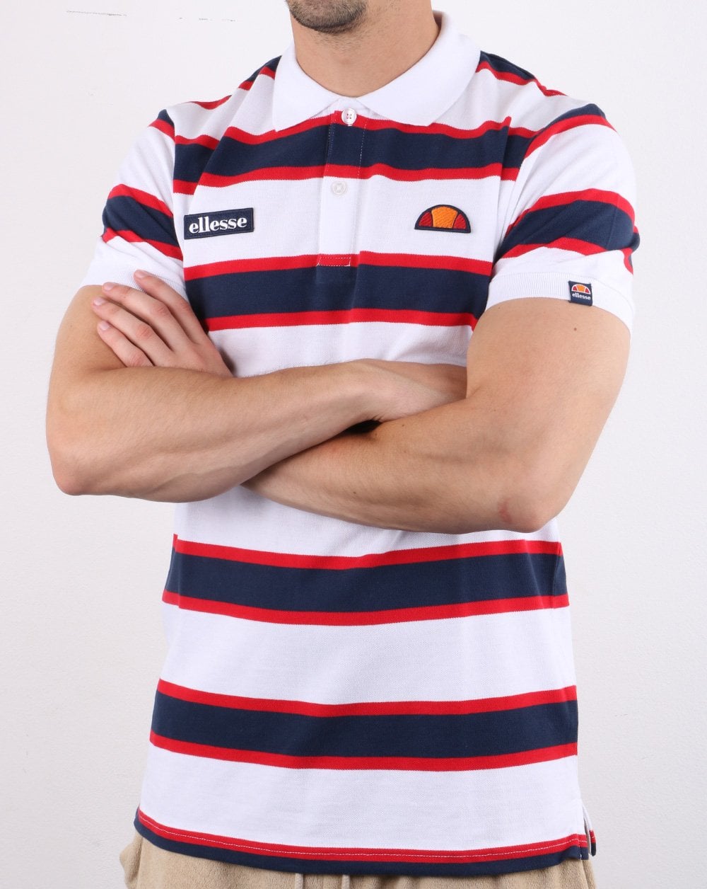 Ellesse – Poloshirt mit kräftigen Streifen, Weiß/Marineblau/Rot