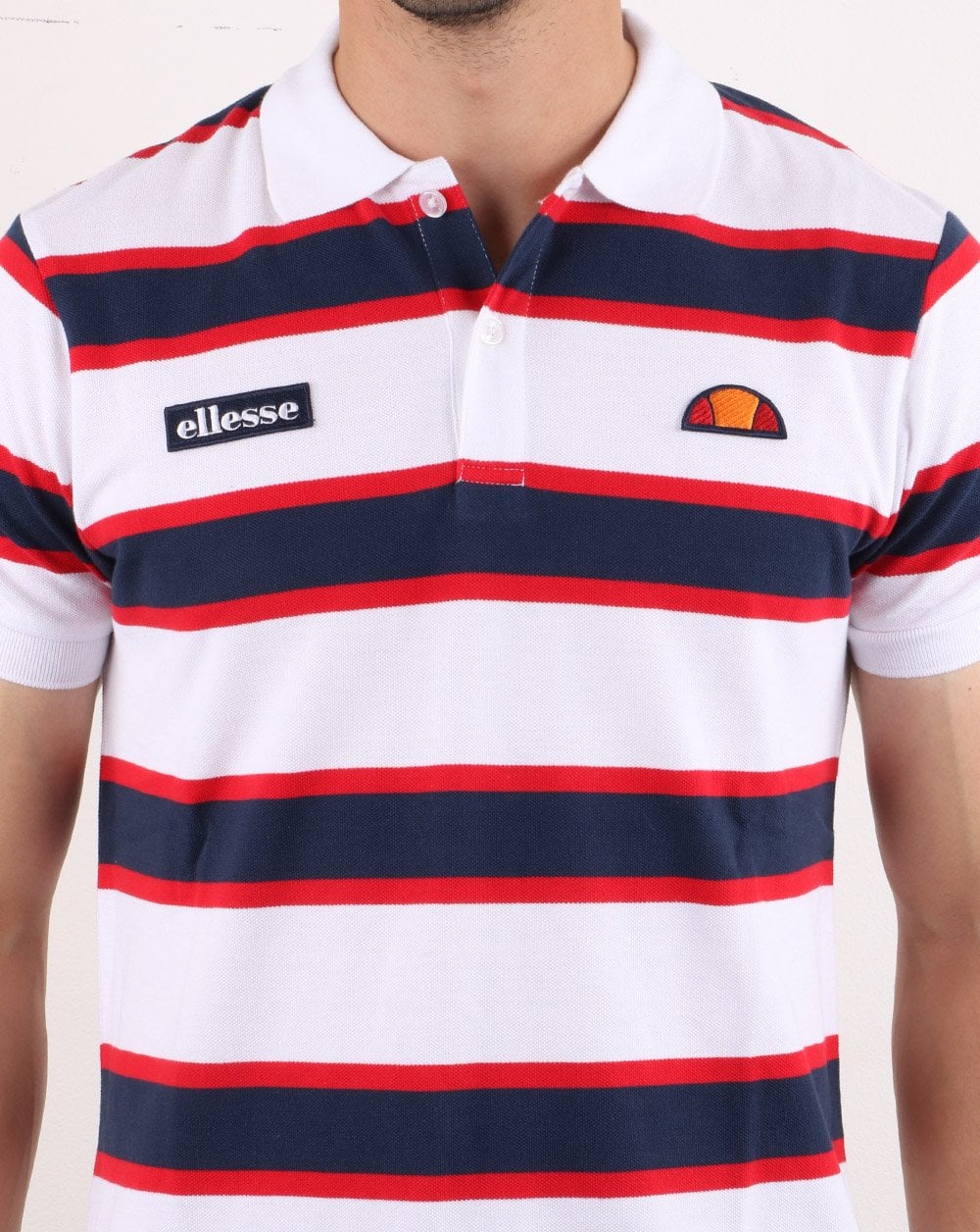 Ellesse – Poloshirt mit kräftigen Streifen, Weiß/Marineblau/Rot