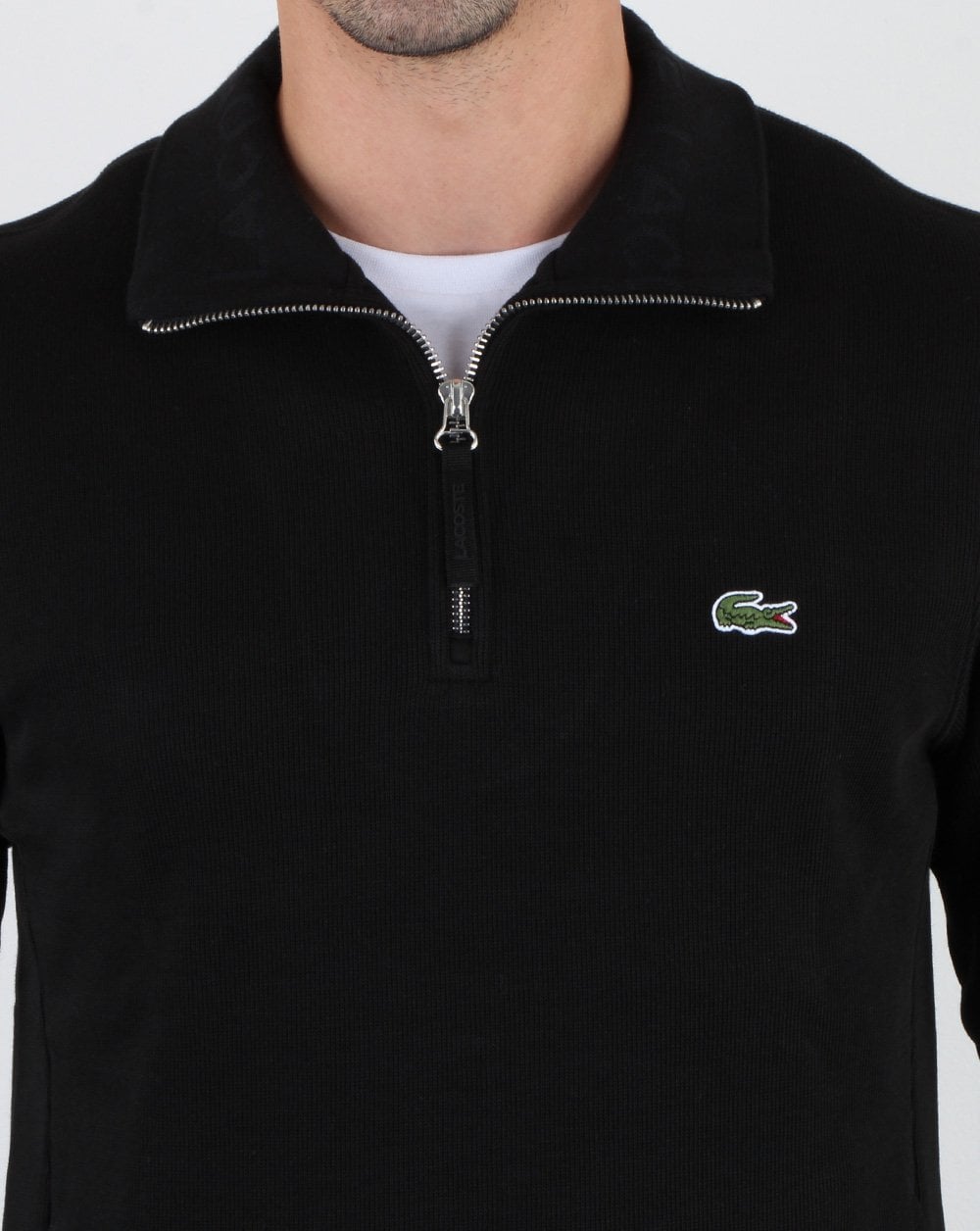 Lacoste – Oberteil mit Viertelreißverschluss in Schwarz