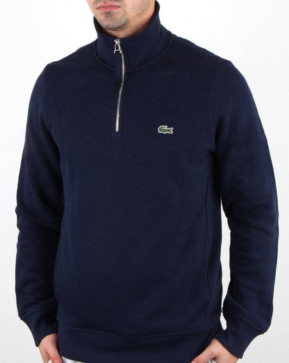 Lacoste – Oberteil mit Viertelreißverschluss in Marineblau