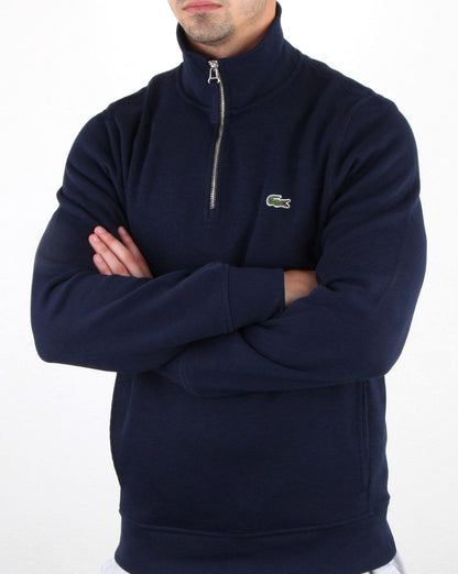Lacoste – Oberteil mit Viertelreißverschluss in Marineblau
