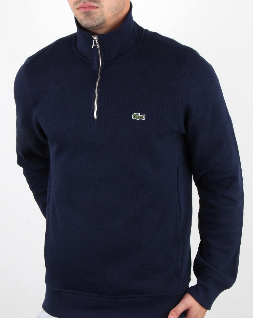 Lacoste – Oberteil mit Viertelreißverschluss in Marineblau