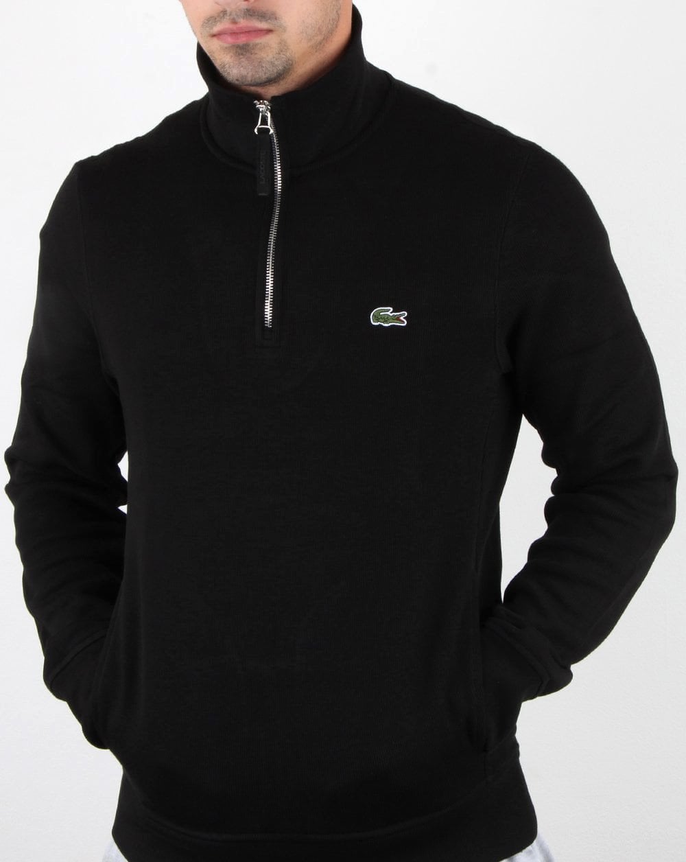 Lacoste – Oberteil mit Viertelreißverschluss in Schwarz