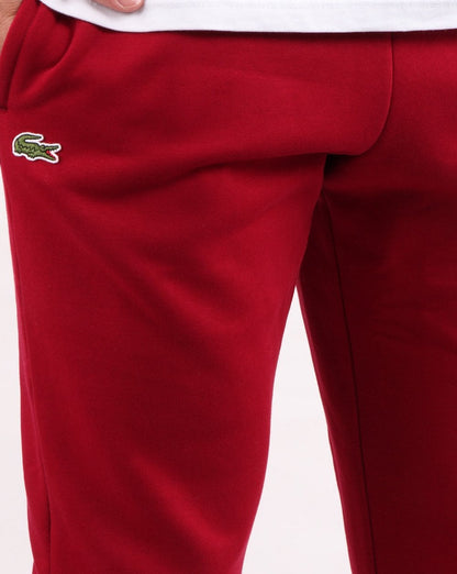Lacoste – Schmale Trainingshose mit Bündchen in Bordeaux