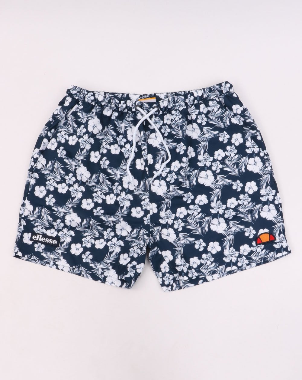 Ellesse – Geblümte Badeshorts in Marineblau und Weiß