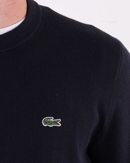 Lacoste – Rundhalspullover aus Baumwollpiqué in Marineblau