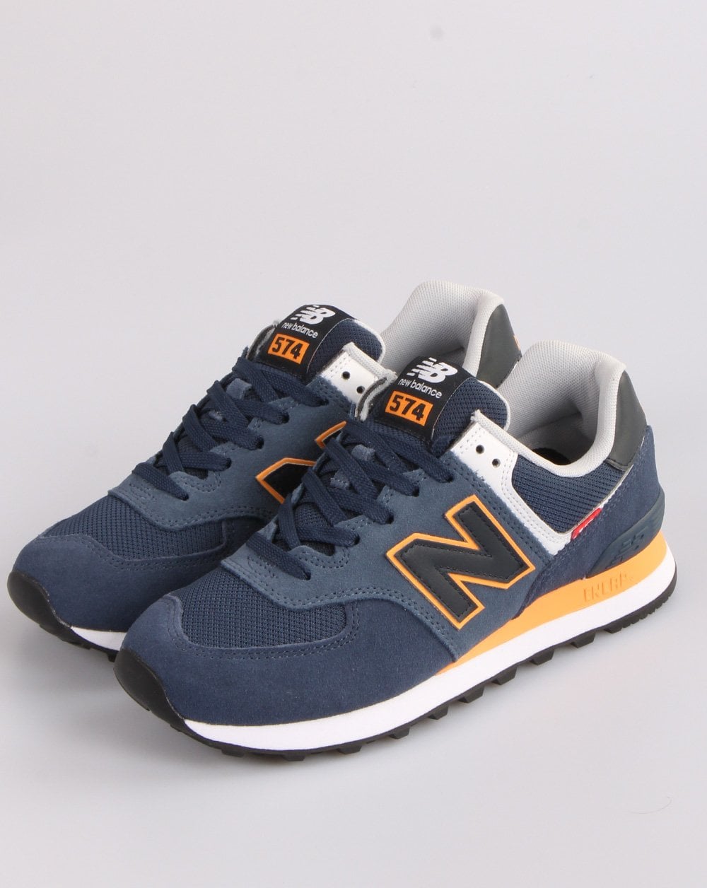 New Balance 574 Trainer Marineblau/Orange