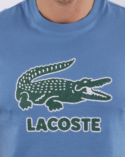 Lacoste – T-Shirt mit Crackled-Print und Logo in Türkisblau