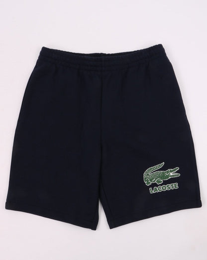 Lacoste – Shorts mit Kroko-Print in Marineblau