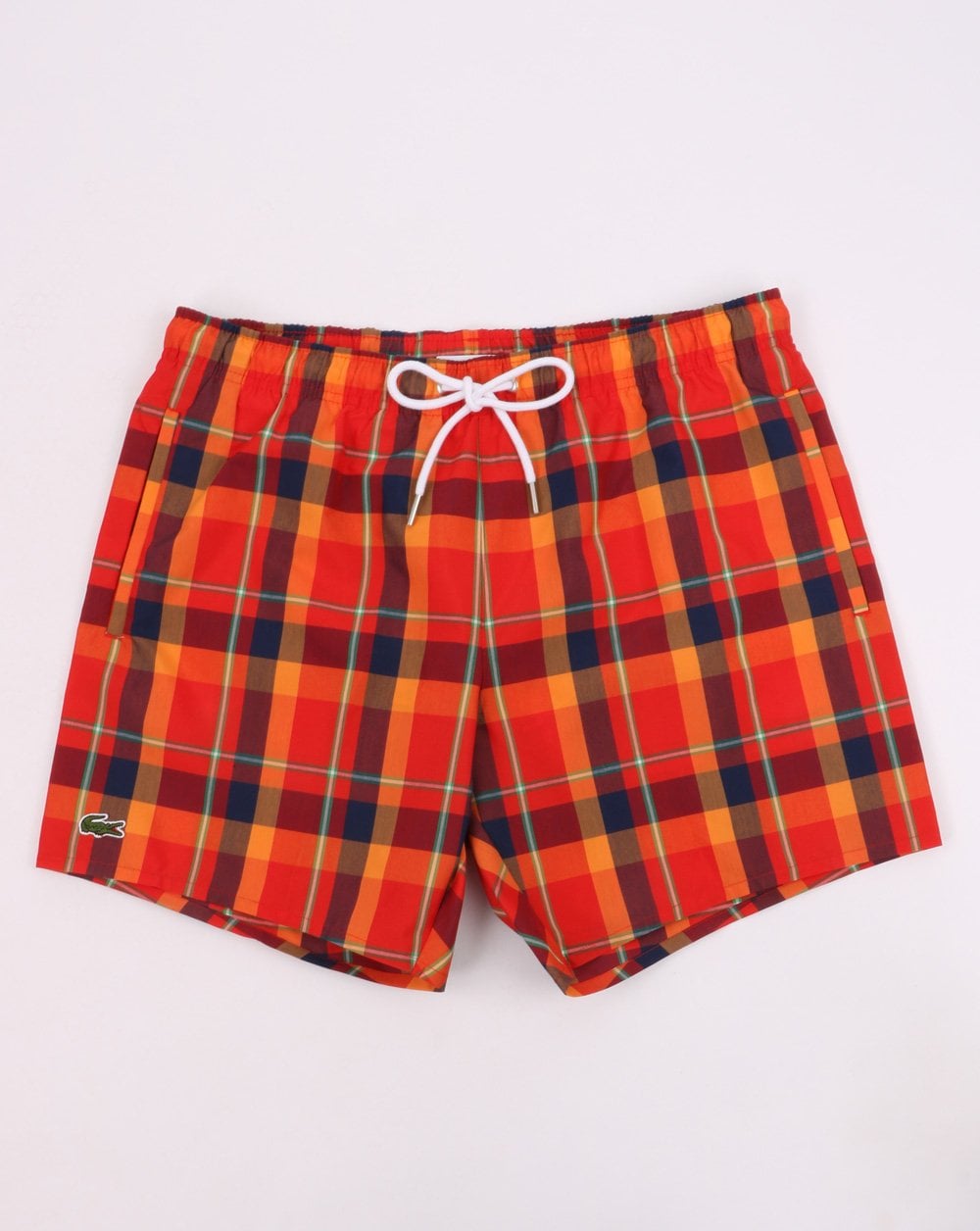Lacoste – Badeshorts mit Karomuster, Rot/Orange