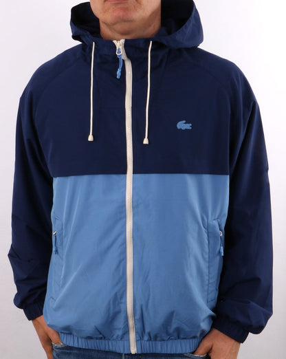 Lacoste – Windbreaker mit Kapuze in Blockfarben, Königsblau/Himmelblau