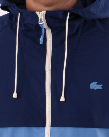 Lacoste – Windbreaker mit Kapuze in Blockfarben, Königsblau/Himmelblau