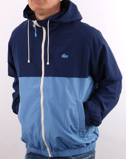 Lacoste – Windbreaker mit Kapuze in Blockfarben, Königsblau/Himmelblau
