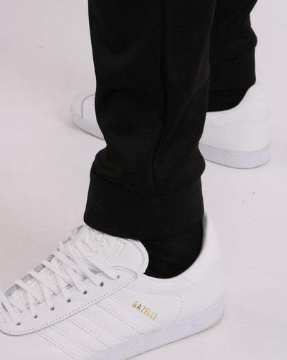 Sergio Tacchini Trainingshose mit Bündchen Schwarz/Gold