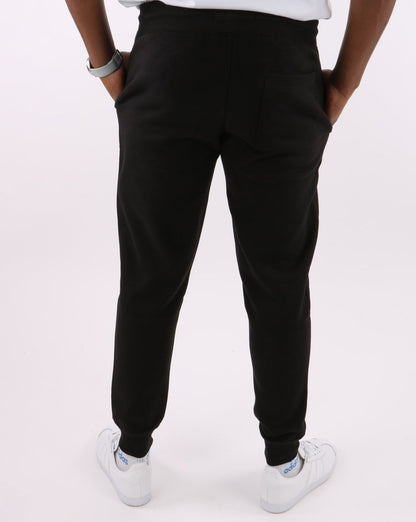 Tommy Jeans – Schmal geschnittene Jogginghose in Schwarz