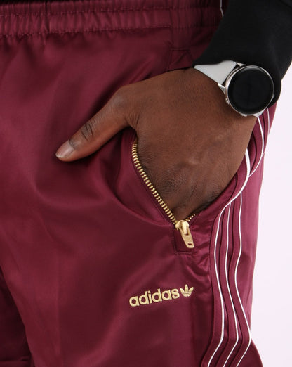Adidas Originals – Firebird – Satin-Trainingshose in Victory Crimson