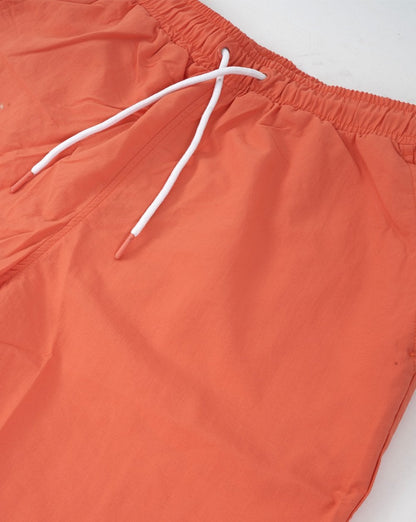 Ellesse – Manti – Badeshorts in Koralle