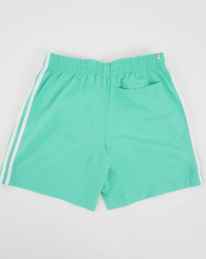 Adidas Originals – Badeshorts mit 3 Streifen in Hi-Res-Grün