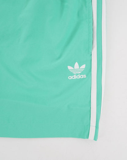 Adidas Originals – Badeshorts mit 3 Streifen in Hi-Res-Grün